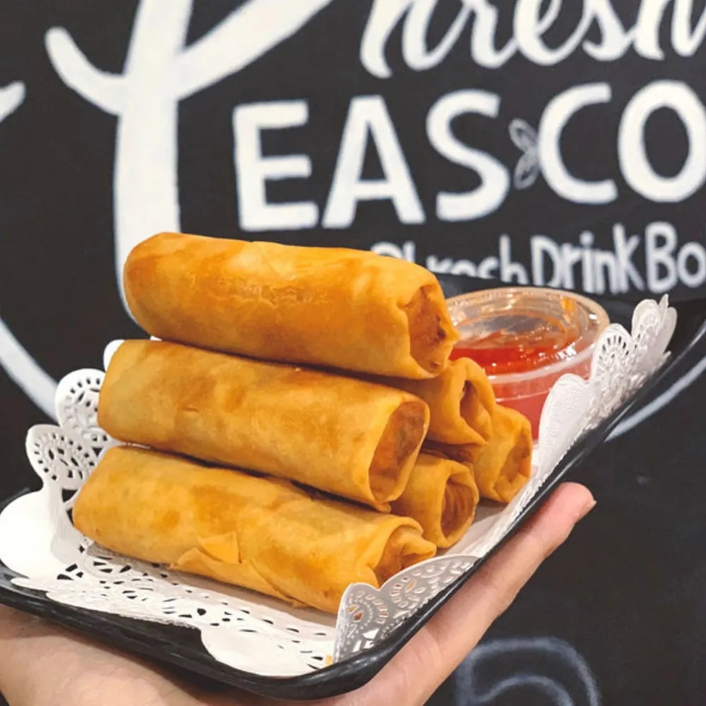 Crispy fried spring rolls with sweet chili sauce at Uniboil Phresh Teas Co, a Hot Pot Restaurant in Goleta.