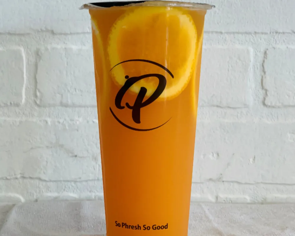 Bright orange iced tea with fresh orange slices at Uniboil Phresh Teas Co, a Hot Pot Restaurant in Goleta.